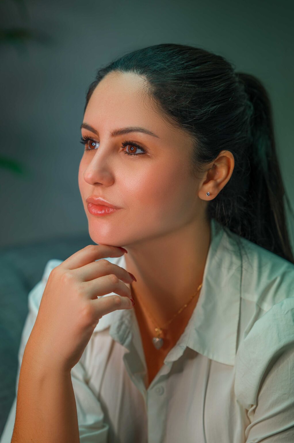 Professional headshot of a woman in a white shirt, Chicago